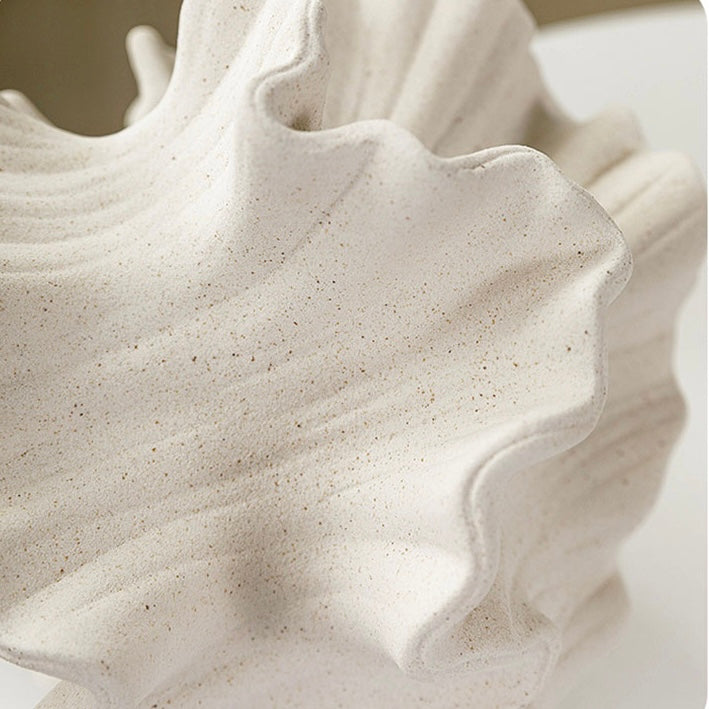 Close-up shot of the unique Ceramic Coral Vase with its captivating swirling patterns and artistic design, perfect for elevating the decor in any living room. Nest Haven Shop, CERAMIC, LIVING ROOM