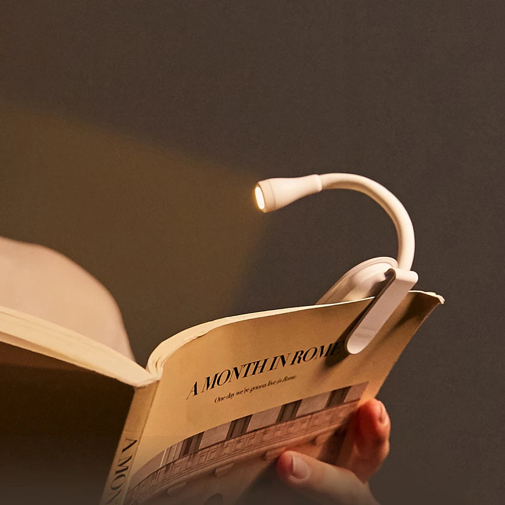 Portable Book Light with 360° flexible neck and sturdy clip, perfect for late-night reading sessions. Soft LED light, compact, and elegant design for cozy reading. Nest Haven Shop, BEDROOM