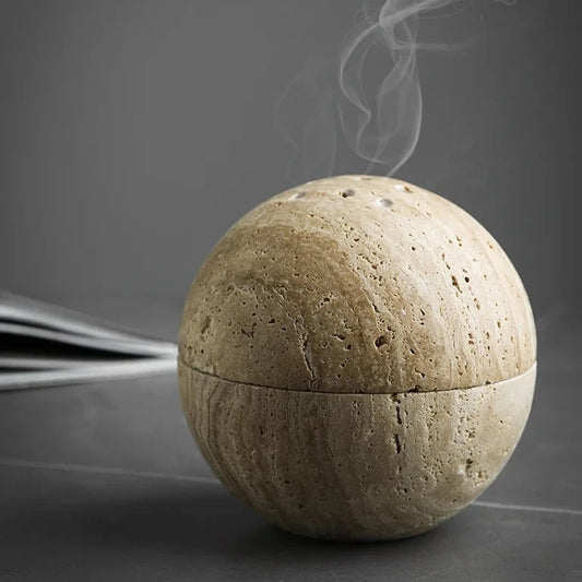 Travertine Aroma Sphere incense burner emitting smoke, perfect for home decoration, yoga, meditation, and aromatherapy, available at Nest Haven Shop, CERAMIC, BEDROOM, OFFICE, BATHROOM, LIVING ROOM.