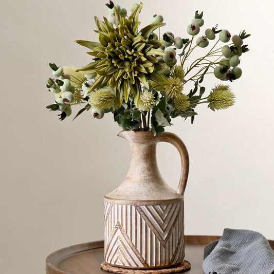 Antique Ceramic Vase filled with gorgeous blooms, adding a sleek, modern touch to a cozy living room space. Nest Haven Shop, CERAMIC, LIVING ROOM