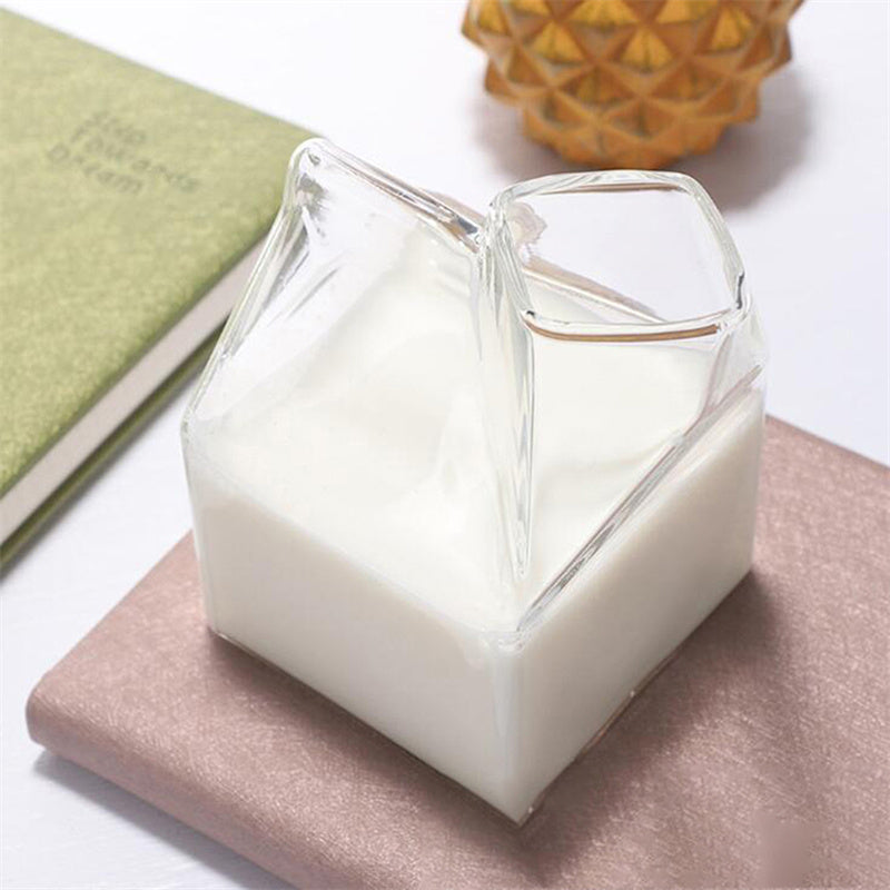 Clear glass carton mimicking a classic milk carton filled with milk, perfect for creative beverage serving, 12oz capacity. Nest Haven Shop, GLASS, KITCHEN